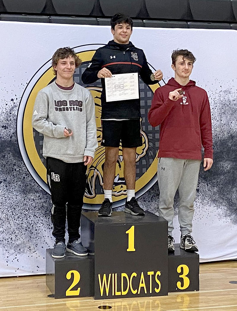 Submitted photo
Blaine Ortiz (middle) won the Big 8 Conference title at 138 pounds.