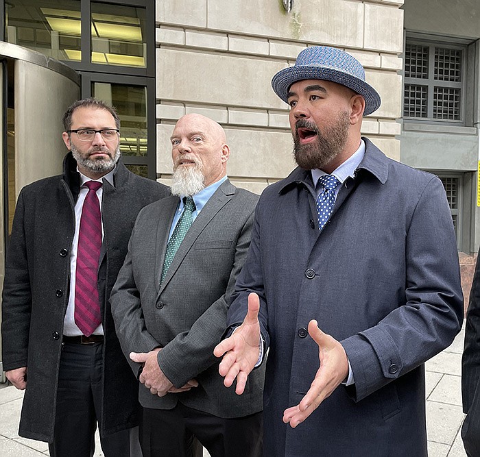 Richard “Bigo" Barnett’s legal team talks with reporters about the the verdict outside federal court in Monday Jan. 23, 2023 in Washington. From left to right, Jonathan Gross, Richard “Bigo” Barnett, Joseph McBride and Bradford L Geyer. (Arkansas Democrat-Gazette/Bill Bowden)