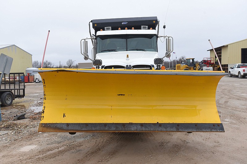 A Benton County truck and plow stands ready on Tuesday Feb. 23 2022 for expected winter weather.  (NWA Democrat-Gazette/Flip Putthoff)