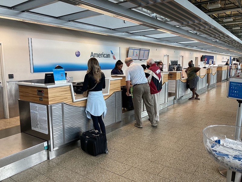 Passengers check in at Northwest Arkansas National Airport on Aug. 17 2022. (NWA Democrat-Gazette/Flip Putthoff)