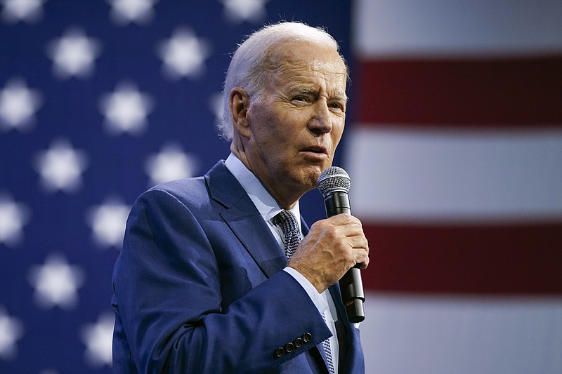 FILE - President Joe Biden speaks during a visit to the Detroit Auto Show, Sept. 14, 2022, in Detroit. Biden persuaded Democrats in Congress to provide hundreds of billions of dollars to fight climate change. Now comes another formidable task: enticing Americans to buy millions of electric cars, heat pumps, solar panels and more efficient appliances.  (AP Photo/Evan Vucci, file)