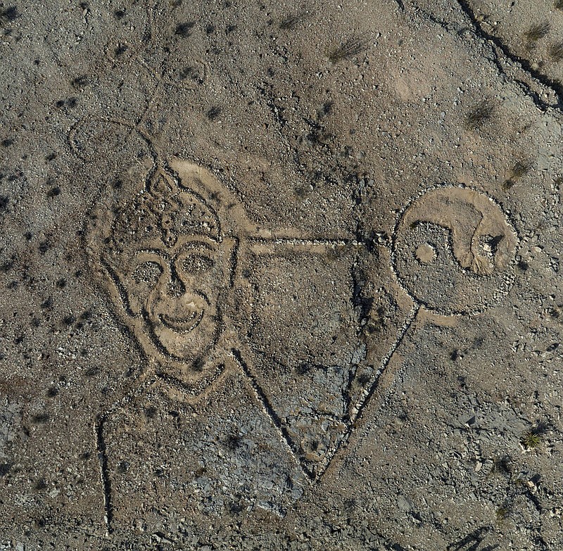 Rocks arranged by an unknown person in the shape of a large triangle with a yin yang at one point and a face at the other are seen, on Thursday, Jan. 19, 2023, in Las Vegas. Dr. Dave Golan discovered a man-made design on the side of a mountain near where he lives in the Mountain's Edge neighborhood in southwest Las Vegas. (Bizuayehu Tesfaye/Las Vegas Review-Journal/TNS)