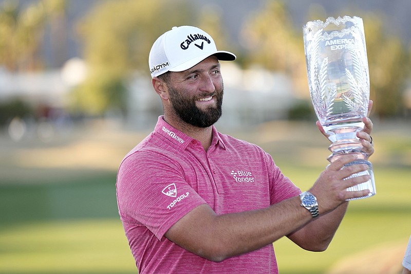 Jon Rahm hold the winner's trophy after the American Express golf tournament on the Pete Dye Stadium Course at PGA West Sunday, Jan. 22, 2023, in La Quinta, Calif. (AP Photo/Mark J. Terrill)