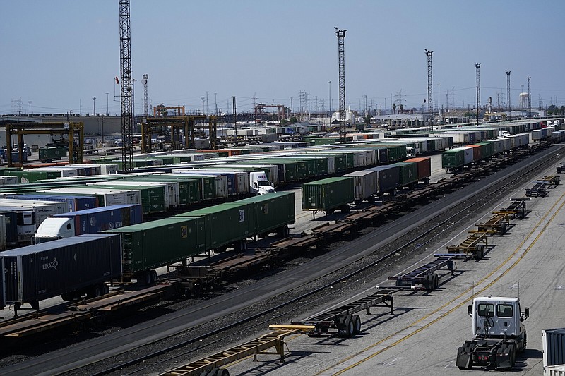 FILE - Freight train cars sit in a Union Pacific rail yard on Wednesday, Sept. 14, 2022, in Commerce, Calif. President Joe Biden said Thursday, Sept. 15, 2022, that a tentative railway labor agreement has been reached, averting a potentially devastating strike before the pivotal midterm elections. (AP Photo/Ashley Landis, File)