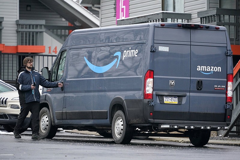 An Amazon Prime driver makes a delivery in Pittsburgh on Monday, Jan. 23, 2023. (AP Photo/Gene J. Puskar)