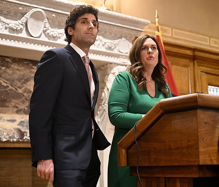 Gov. Sarah Huckabee Sanders answers questions from reporters with her husband, Bryan Sanders, during a news conference Tuesday at the state Capitol in Little Rock as she announces him as the head of a new council to promote outdoor recreation and tourism.

(Arkansas Democrat-Gazette/Stephen Swofford)