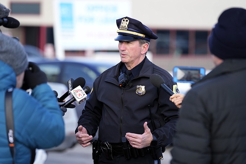 Des Moines Police spokesman Sgt. Paul Parizek speaks outside the Starts Right Here building, Monday, Jan. 23, 2023, in Des Moines, Iowa. Police say two students were killed and a teacher was injured in a shooting at the Des Moines school on the edge of the city's downtown. (AP Photo/Charlie Neibergall)