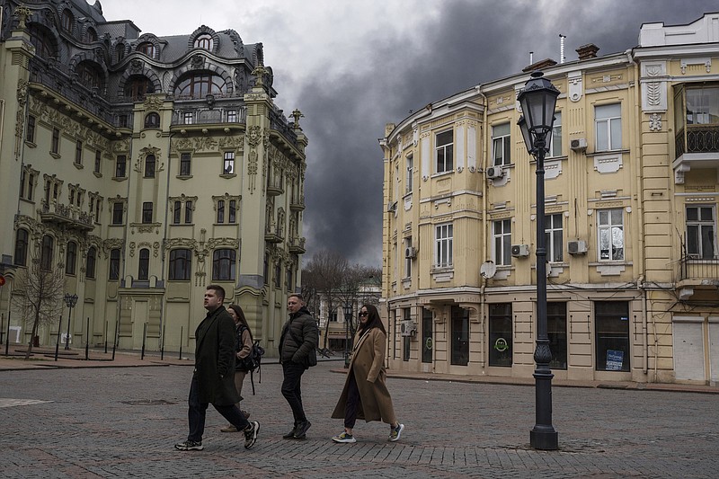 People walk in a street April 3 as smoke rises in the air after shelling in Odesa, Ukraine.
(File Photo/AP/Petros Giannakouris)
