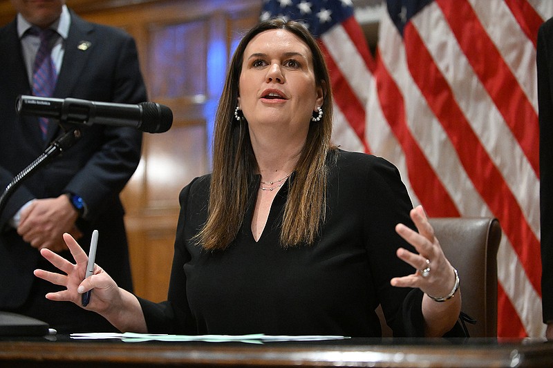 Gov. Sarah Huckabee Sanders speaks before signing HB 1023, which requires flags purchased with public funds to be made in the United States, Thursday at the state Capitol in Little Rock.
(Arkansas Democrat-Gazette/Staci Vandagriff)