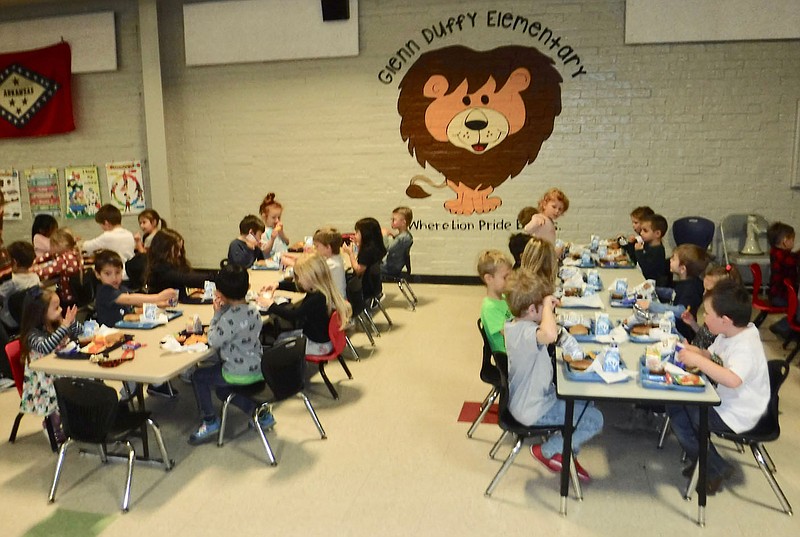 Susan Holland/Westside Eagle Observer
Students at Glenn Duffy Elementary School eat their lunch in the cafeteria during the school's 100 Days of School celebration Friday, Jan. 27. Several youngsters at the school dressed in costume for the special day of celebration, wearing clothing they imagined they would wear when they were 100 years old.