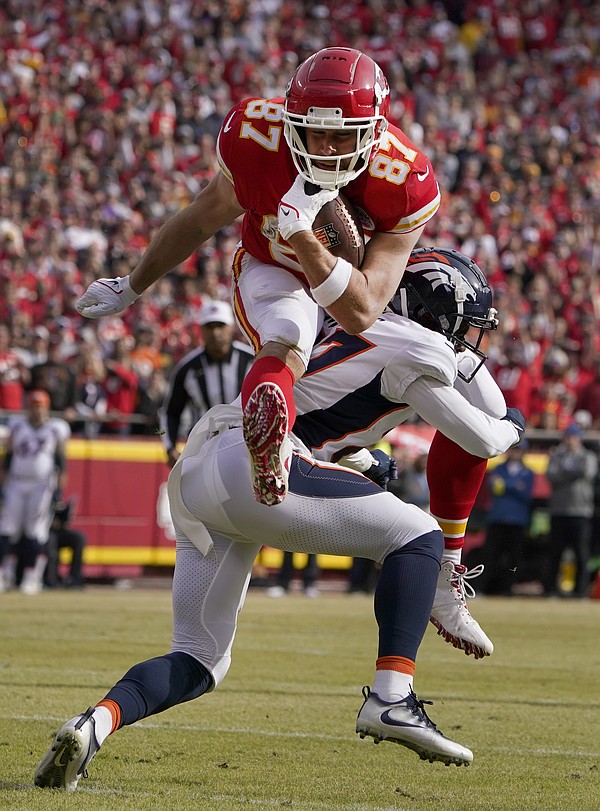 Cincinnati Bengals tight end Hayden Hurst (88) leaps over Buffalo Bills  safety Jaquan Johnson (4) during the second half of an NFL division round  football game, Sunday, Jan. 22, 2023, in Orchard