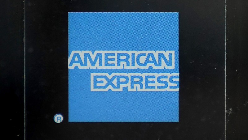 FILE - An American Express logo is attached to a door in Boston's Seaport District, Wednesday, July 21, 2021.  American Express reports earnings on Friday, Jan. 27, 2023. (AP Photo/Steven Senne)