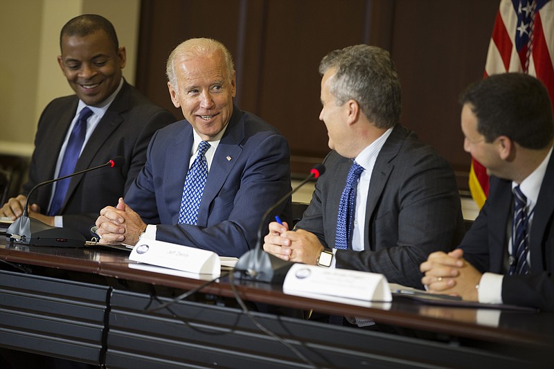 FILE - Vice President Joe Biden speaks during the White House Build America Investment Initiative roundtable, Wednesday, Oct. 14, 2015, in the Eisenhower Executive Office Building on the White House complex in Washington. From left are, then-Transportation Secretary Anthony Foxx, Biden, then-National Economic Council Director Jeff Zients, and then-Senior Policy Adviser at the National Economic Jake Broder-Fingert. (AP Photo/Evan Vucci, File)