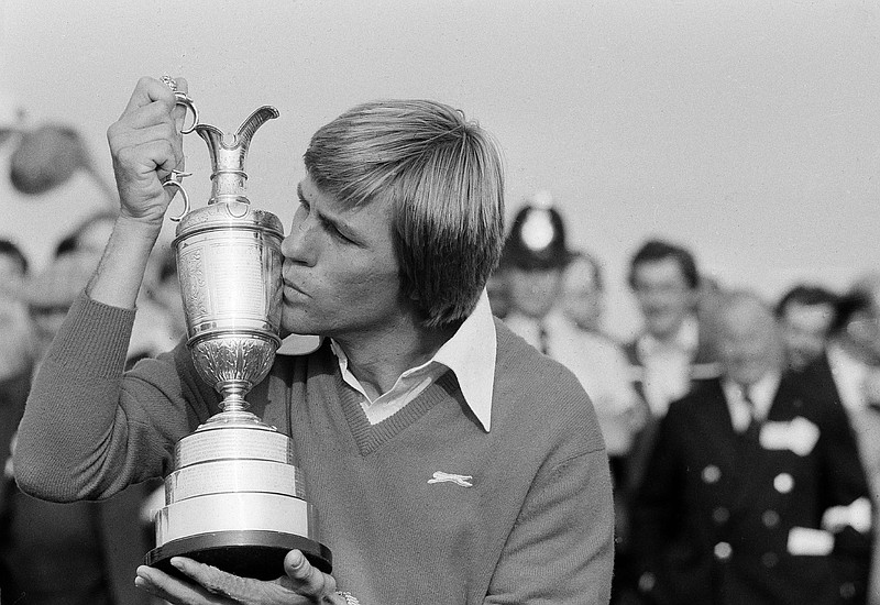 Golfer Bill Rogers kisses his winner's trophy after the British Open Golf Championship, July 18, 1981, in Sandwich, England. (AP Photo)