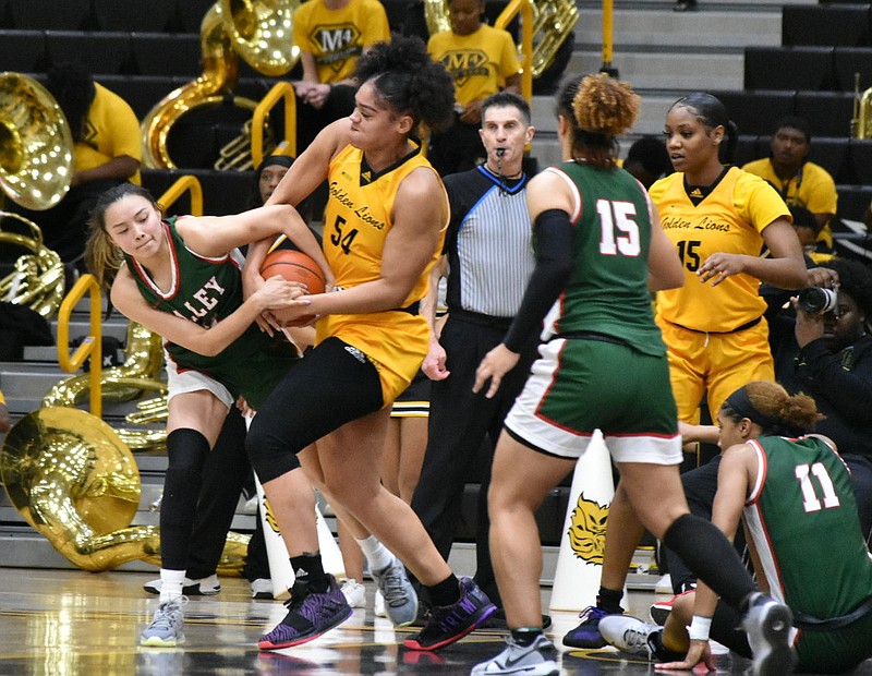 Maya Peat of UAPB tries to wrestle the ball away from Lexus Eagle Chasing of Mississippi Valley State in the first half Saturday at H.O. Clemmons Arena. (Pine Bluff Commercial/I.C. Murrell)