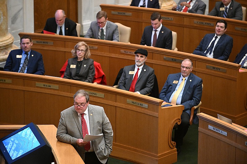 Rep. Lane Jean (bottom), R-Magnolia, waits to speak during the House session Wednesday at the state Capitol.
(Arkansas Democrat-Gazette/Staci Vandagriff)