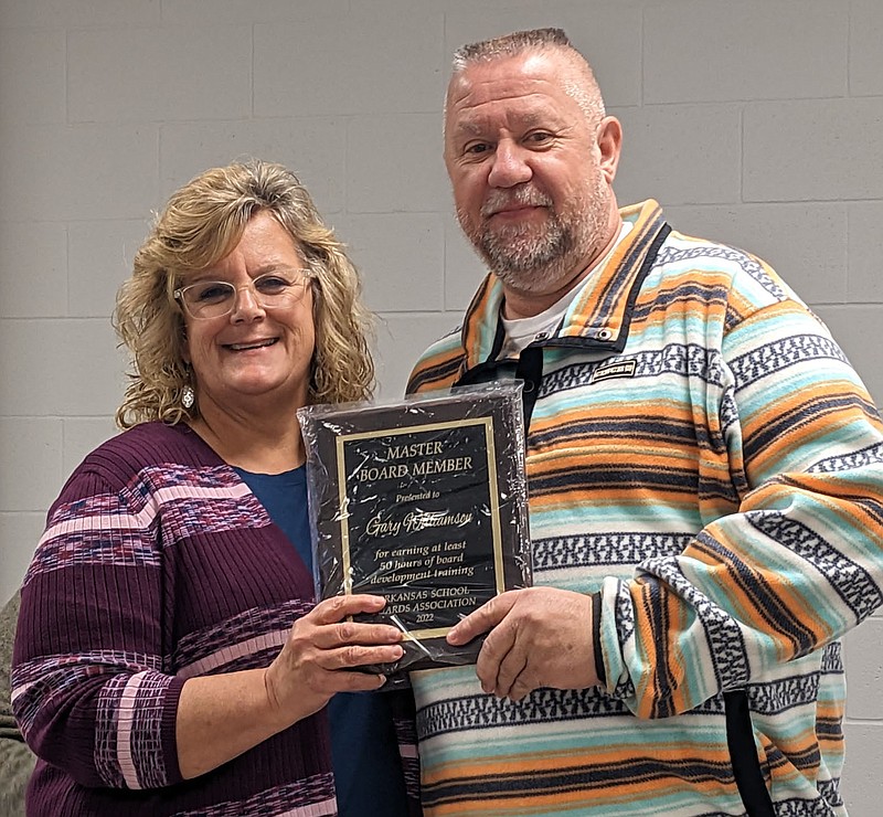 Randy Moll/Westside Eagle Observer
Gentry School Board member David Williamson received a Master Board Member plaque from Superintendent Terrie DePaola on Jan. 23 for completing 50 hours of training for service on a school board.