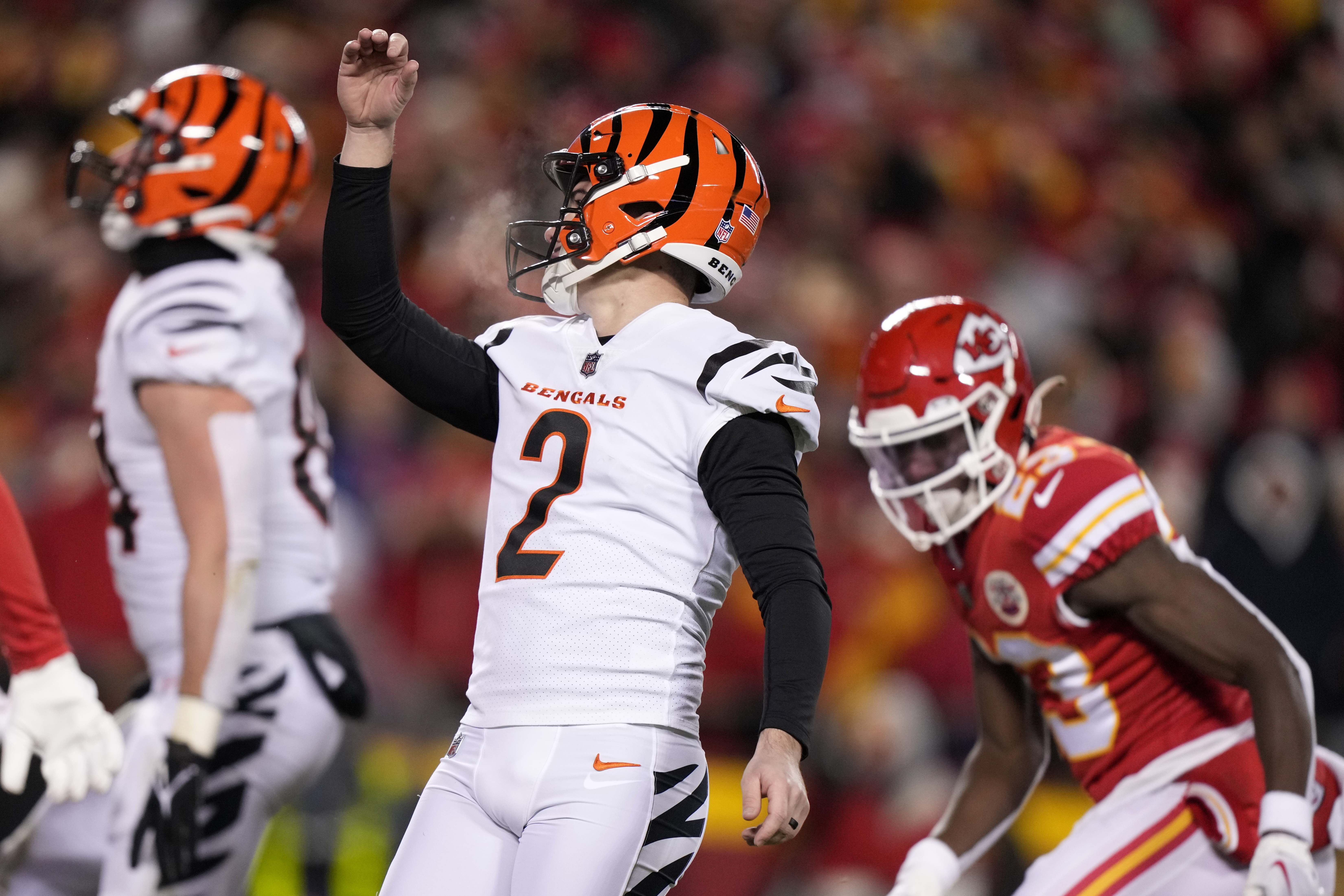 Cincinnati Bengals free safety Jessie Bates (30) and Mike Hilton celebrate  after breaking up a pass during the first half of an NFL football game  against the Kansas City Chiefs, Sunday, Jan.