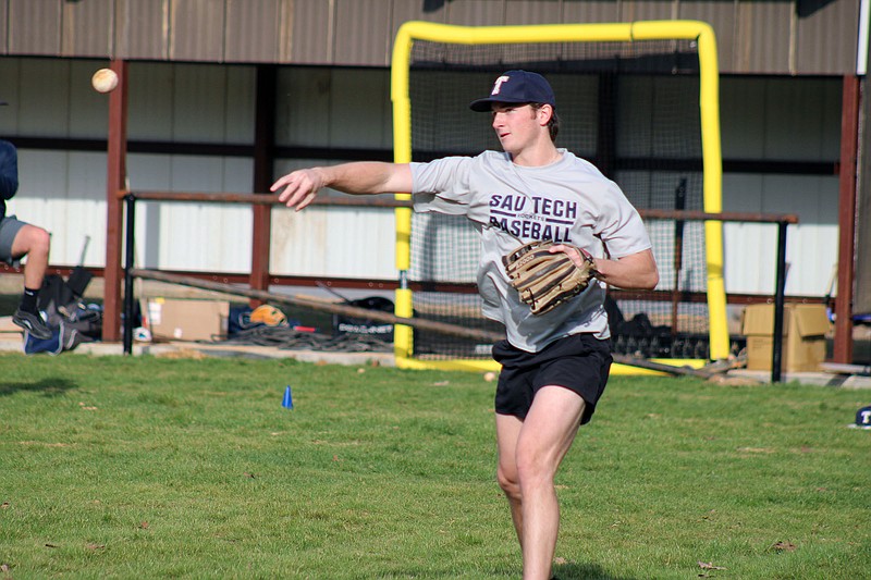 Photo By: Michael Hanich
SAU Tech pitcher Jaden Woolbright tosses the ball to an infield player in practice.