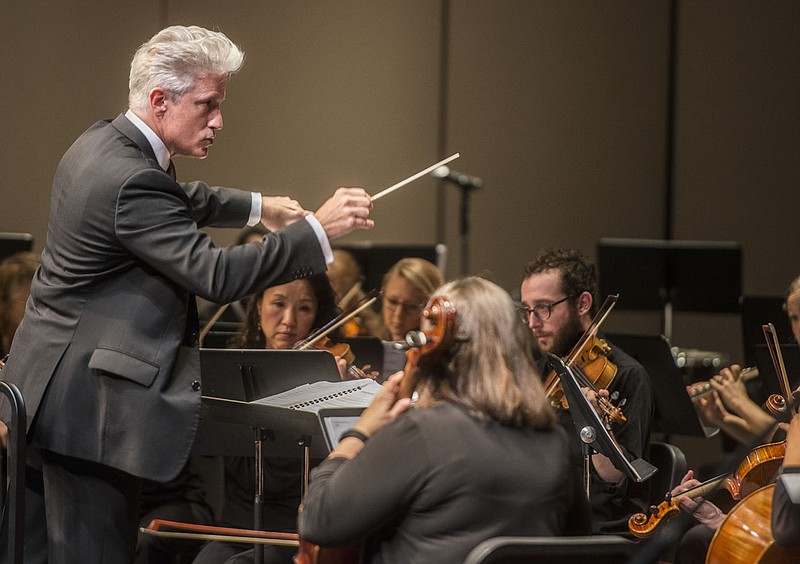 NWA Democrat-Gazette/ANTHONY REYES ¥ @NWATONYR
Steven Byess, music director of the Arkansas Philharmonic Orchestra, conducts the orchestra Friday, May 15, 2015 during a concert at the Fayetteville High School Performing Arts Center. The concert is part of Carnegie HallÕs Weill Music InstituteÕs Link Up program, which pairs orchestras across the country with local schools. The program included a year-long music curriculum which allowed the students to participate during the concert with music and dance.