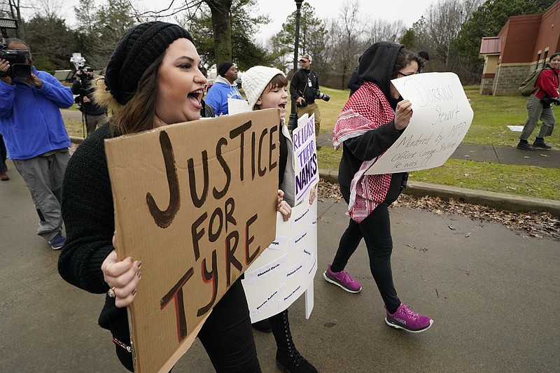 AP A group of demonstrators protest Sunday outside a police precinct in response to the death of Tyre Nichols, who died after being beaten by Memphis police officers, in Memphis, Tennessee.