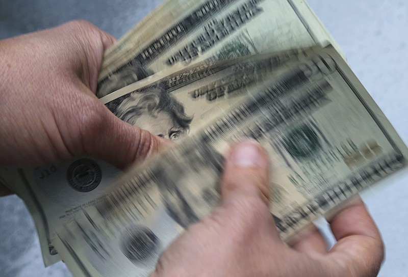 Unfocused spending makes it harder to afford your own place. (AP file photo/Elise Amendola)