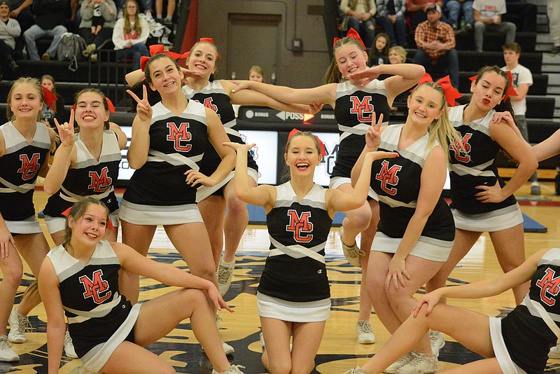 Bennett Horne/McDonald County Press MC Cheer got the Homecoming crowd cheering and on its feet for the Mustangs and Lady Mustangs on Friday, Jan. 13, at Mustang Arena.