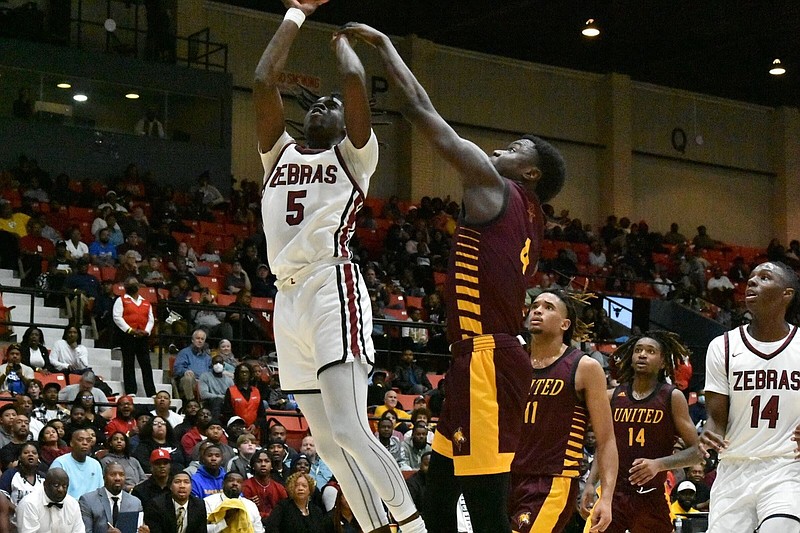 Pine Bluff and Beaumont (Texas) United high schools met in a bracket final of the King Cotton Holiday Classic on Dec. 29. Shooting the ball for Pine Bluff is Courtney Crutchfield. (Pine Bluff Commercial/I.C. Murrell)
