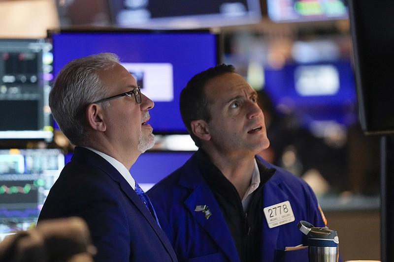 Traders work on the floor at the New York Stock Exchange in New York, Wednesday, Feb. 1, 2023. (AP Photo/Seth Wenig)