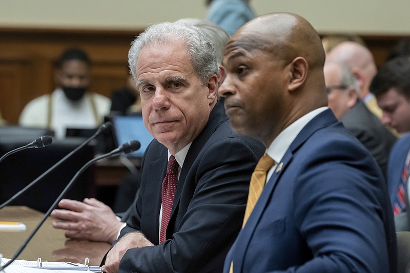 Michael Horowitz, left, who chairs a watchdog panel with oversight of COVID-19 spending, and David Smith, an assistant director of the Office of Investigations at the U.S. Secret Service, testifies before the House Oversight and Accountability Committee about waste and fraud in COVID-19 relief programs, at the Capitol in Washington, Wednesday, Feb. 1, 2023. (AP Photo/J. Scott Applewhite)