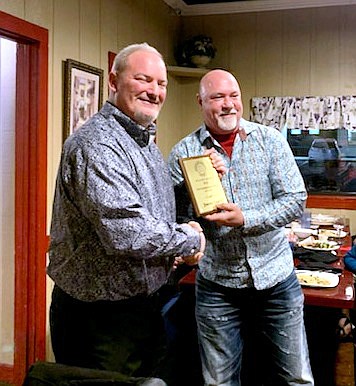 Vince Hotho of Fun City Chorus presents the New Barbershopper of the Year Award to Jimmy Leach. - Submitted photo