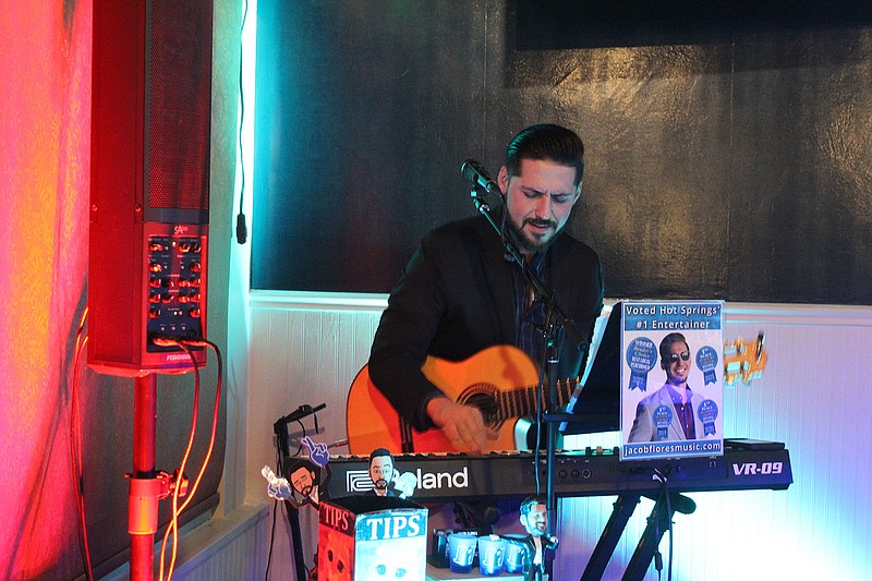 Jacob Flores live loops using his keyboard during his performance at J and S Italian Villa on a Friday night.  – Photo by Courtney Edwards of The Sentinel-Record