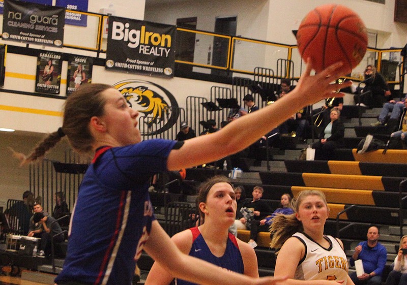 Senior forward Lauren Friedrich scoops and scores for the Lady Pintos as part of a 16-6 third quarter run for California. Friedrich had 16 points, seven rebounds, two assists, two steals, and two blocks against Smith-Cotton on Thursday night. (Democrat photo/Evan Holmes)