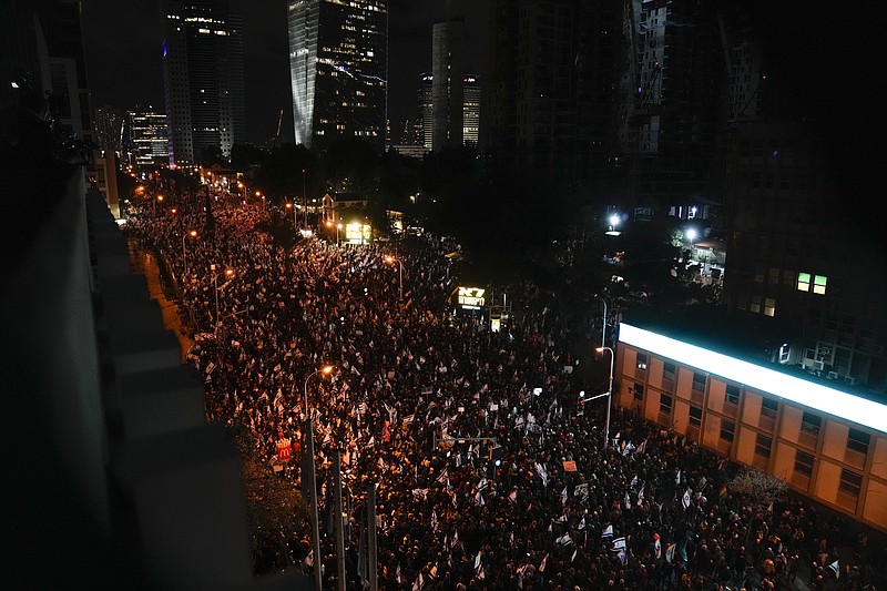 Israelis protest against the plans by Prime Minister Benjamin Netanyahu's new government to overhaul the judicial system, in Tel Aviv, Israel, Saturday, Feb. 4, 2023. (AP Photo/Maya Alleruzzo)