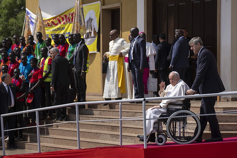 Pope Francis gestures to those gathered as he leaves after addressing clergy at the St. Theresa Cathedral in Juba, South Sudan Saturday, Feb. 4, 2023. Pope Francis is in South Sudan on the second leg of a six-day trip that started in Congo, hoping to bring comfort and encouragement to two countries that have been riven by poverty, conflicts and what he calls a "colonialist mentality" that has exploited Africa for centuries. (AP Photo/Ben Curtis)