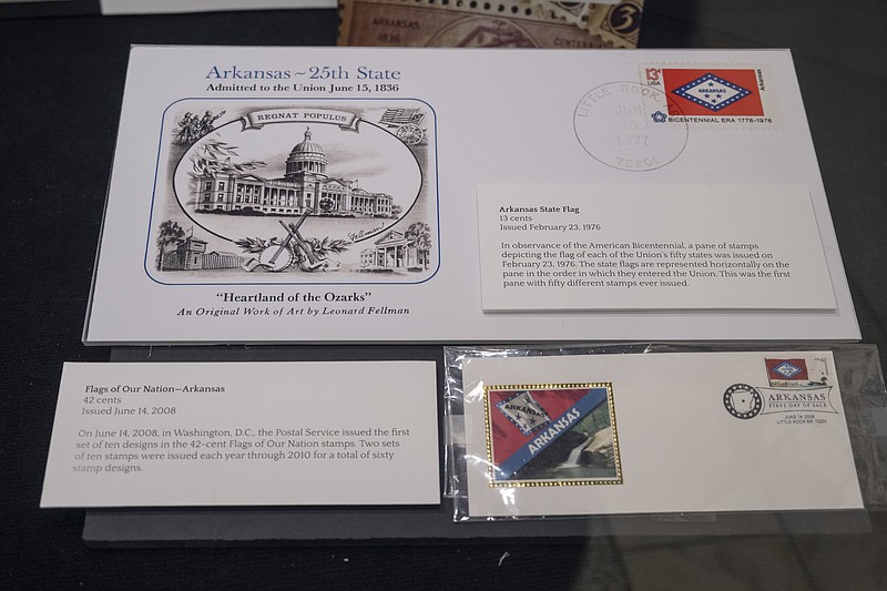 “Special Delivery: Postal History in Arkansas,” on display through Memorial Day at the state Capitol, includes first-day-of-issue covers of Arkansas flag stamps and a collection of hand stamps used by former Little Rock postmaster Roy L. Sharpe. (Special to the Democrat-Gazette)