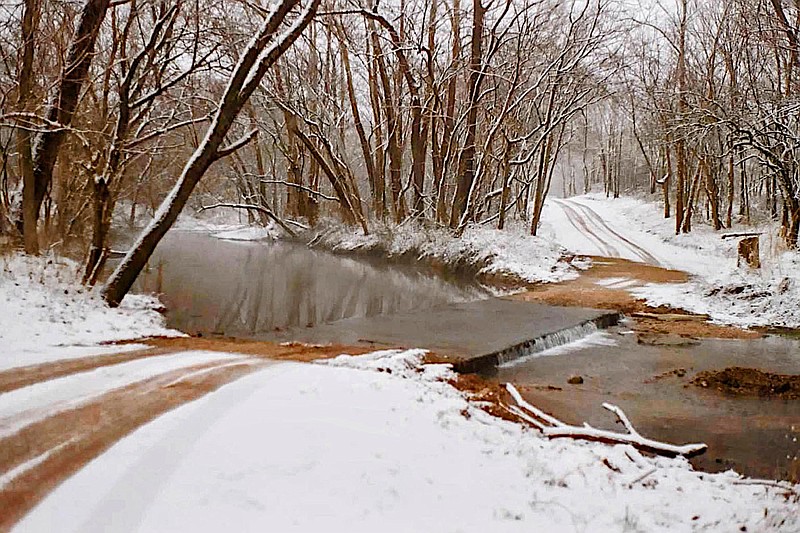 Westside Eagle Observer/Randy Moll
This image from the past shows the old Springtown Road low-water bridge after a snow.