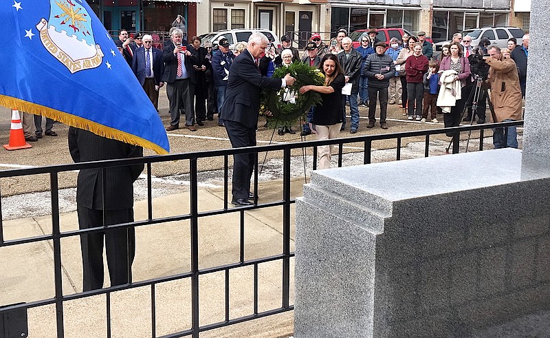 Gerald Murray and Tia McConnell place a wreath at the Cass County Courthouse memorial in honor of John O’Neal Rucker of Linden, the last enlisted service man to die in the Vietnam War. The wreath also honors veterans and the 50th anniversary of the end of the Vietnam War. (Photo by Neil Abeles)