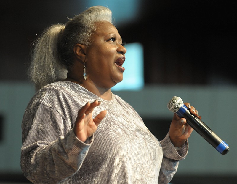 Ocie Fisher sings in 2015 during the "Let There Be Light, 100 Black Men" project by photographer Andrew Kilgore at St. James Missionary Baptist Church in Fayetteville. Divas On Fire, The Ocie Fisher Band and the St. James Gospel Tribute will perform starting at 2 p.m. Feb. 26 at George’s Majestic Lounge in Fayetteville in a fundraiser for Fisher, who suffered a recent stroke.

NWA Democrat-Gazette File Photo/Andy Shupe)