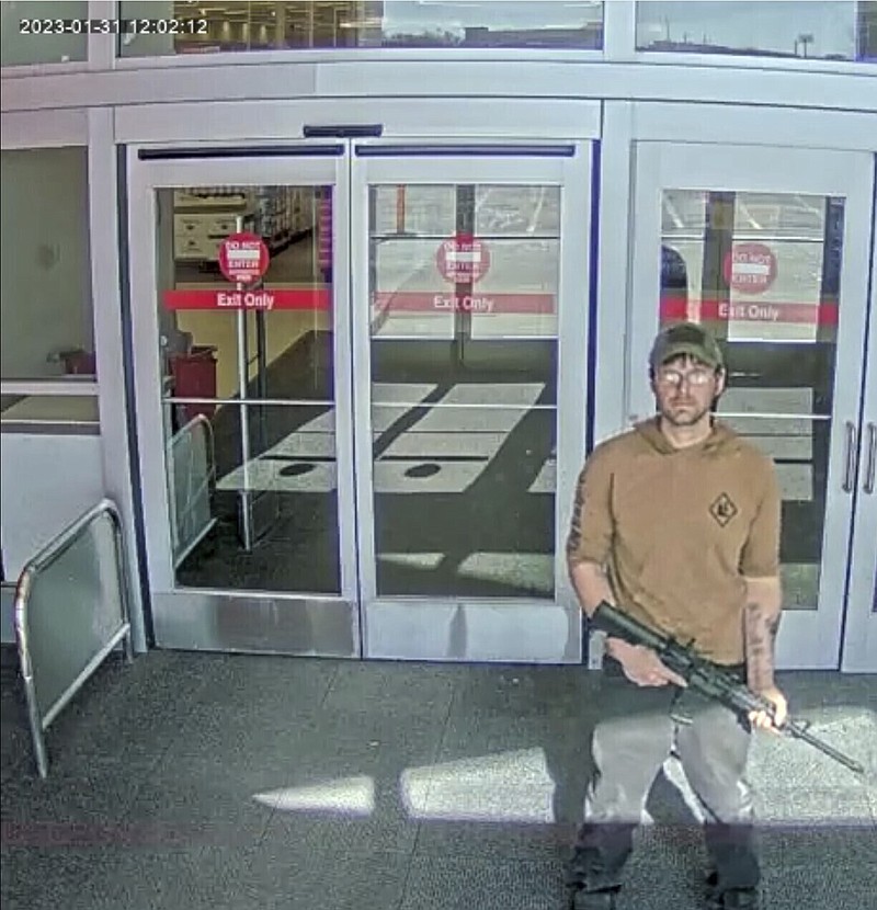FILE - In this image taken from security camera footage provided by the Omaha, Neb., Police Department, a man identified by police as Joseph Jones, armed with an AR-15-style rifle, is seen at a Target store in Omaha on Jan. 31, 2023, before police fatally shot him. Jones, who entered the Omaha Target with an AR-15-style rifle and began firing before he was killed by police had been repeatedly sent to psychiatric hospitals because of his schizophrenia. But because Jones was never formally committed, he was able to keep purchasing guns legally, underscoring how little so-called red-flag laws do to keep firearms away from deeply troubled people. (Omaha Police Department via AP, File)