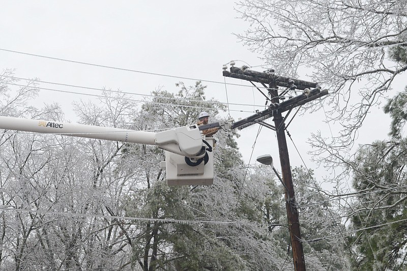 A lineman works to restore power at the Pine Bluff Arsenal following a winter storm last week. (Special to The Commercial/Deborah Horn)