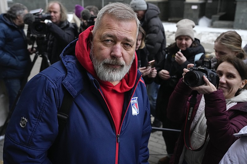 Nobel Peace Prize awarded journalist Dmitry Muratov, editor-in-chief of the influential Russian newspaper Novaya Gazeta, surrounded by journalists leaves the Moscow City Court after the delivering of a ruling on Novaya Gazeta's appeal against an earlier verdict, in Moscow, Russia, Tuesday, Feb. 7, 2023. The Moscow City Court upheld an earlier verdict to revoke the license of Novaya Gazeta, a top independent newspaper that has been critical of the Kremlin for years. (AP Photo/Alexander Zemlianichenko)