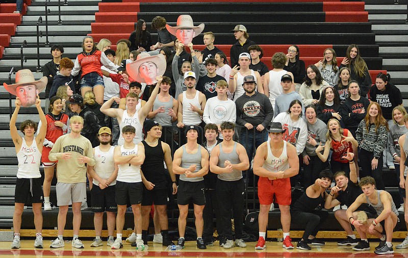 Bennett Horne/McDonald County Press The McDonald County student section showed up in full force Tuesday night in cheering the Mustangs and Lady Mustangs on to victories at Mustang Arena.