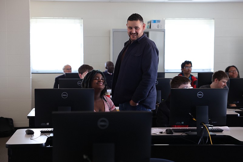 Courtesy/Brittany Ruess,JC Schools: 
Capital City teacher Jon Lindquist walks behind a row of computer desks at Lincoln University as high school students learn about encrypting from a Cyber.org instructor. Lindquist will be one of two teachers in the Jefferson City School District to offer a cybersecurity course starting next school year.