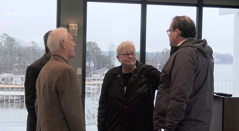 Liz Robbins, center, speaks with members of the Rotary Club of Hot Springs National Park following her presentation on Wednesday. – Photo by Courtney Edwards pf The Sentinel-Record