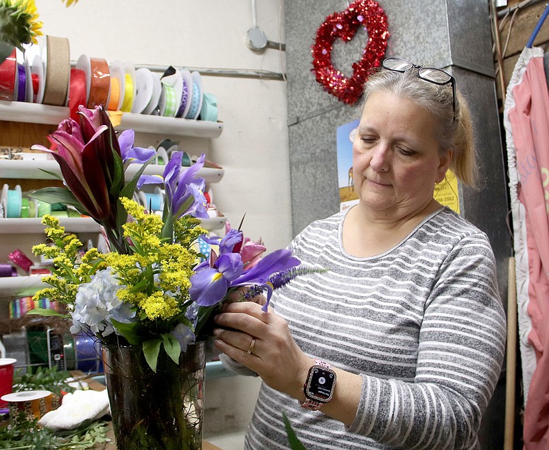 Lynn Kutter/Enterprise-Leader
Leslie Tabor with Flowers-N-Friends in Prairie Grove designs a flower arrangement Saturday morning, Feb.11, 2023, to be delivered for Valentine's Day. The florist stayed busy over the weekend with many Valentine's Day orders.