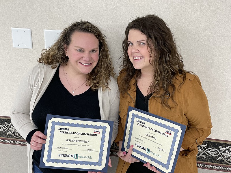 Democrat photo/Kaden Quinn: 
From left, Jessica Connelly and Laci Rains celebrate their win at MRED's Start LaunchU Pitch competition as they receive certificates of completion from the organization.