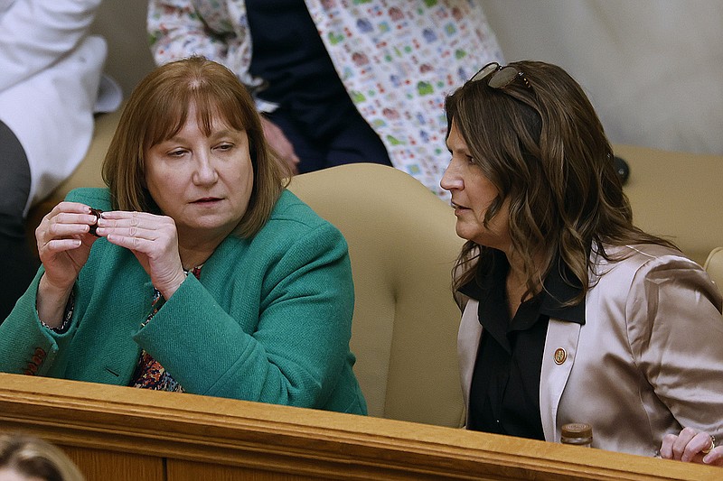 Rep. Frances Cavenaugh (left), R-Walnut Ridge, speaks with Rep. Sonia Eubanks Barker, R-Smackover, before the House session on Monday, Feb. 13, 2023, at the state Capitol in Little Rock. (Arkansas Democrat-Gazette/Thomas Metthe)