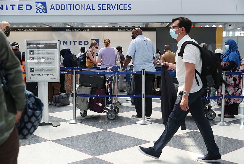 United Airlines passengers wait to check in bags in Terminal 1 at O'Hare International Airport, June 29, 2021, in Chicago. Lost luggage is one airline mishap that can be covered by travel insurance. (John J. Kim/Chicago Tribune/TNS)