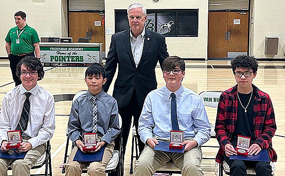 Third District Rep. Steve Womack, R-Rogers, has a picture made with Congressional App Challenge winners (from left) Brannon Davidson, Isaac Sayarath, Jacob Steinsiek, and Adan Diaz at Van Buren Freshman Academy. (Courtesy Photo/Rep. Steve Womack's Office)